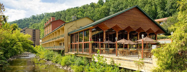 View of the River Terrace Resort on the River with dining area in Gatlinburg wide