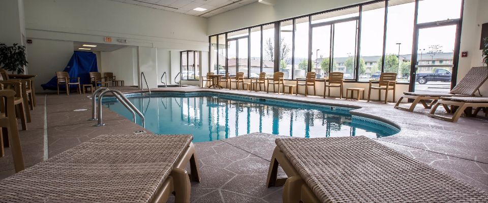 View of the Heated Indoor Pool from the foot of 2 Lounge Chairs at the Comfort Inn and Suites at Dollywood Lane in Pigeon Forge 960