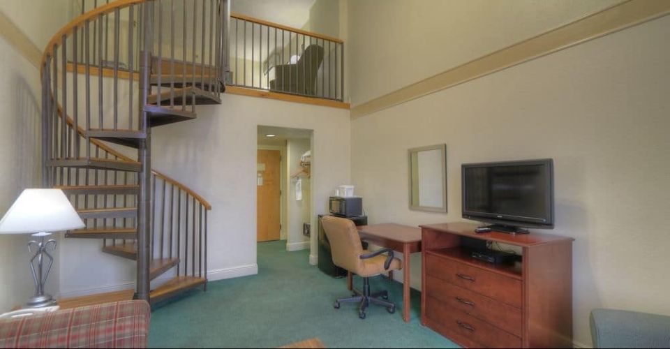 View of the Downstairs and Spiral Staircase of the Penthouse room at the Country Cascades in Pigeon Forge Tn