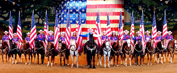 View of the American Flag and Riders at the Dixie Stampede in Pigeon Forge wide