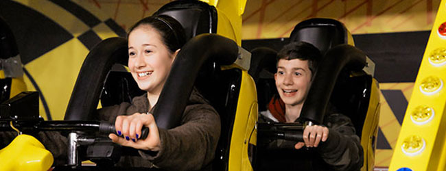 Kids on the Extreme 360 Bike Ride at the Wonderworks Indoor Amusement Park in Pigeon Forge