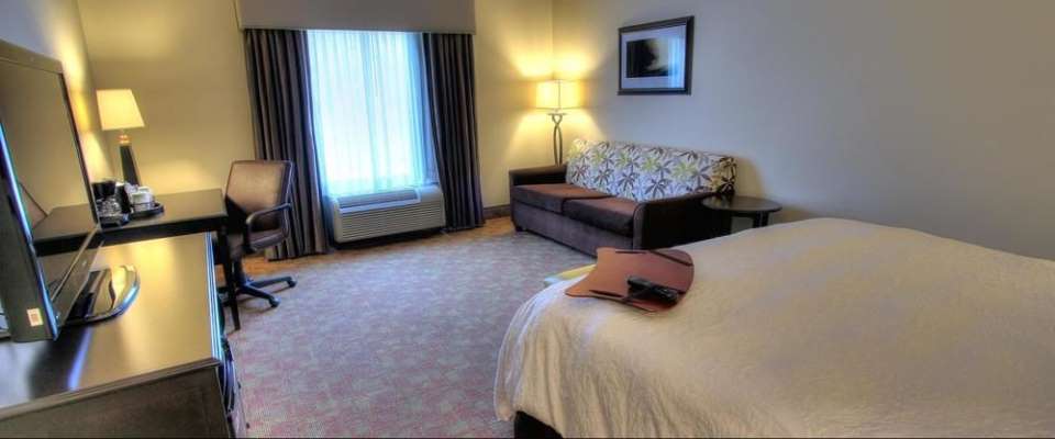 View of the King room with additional sleeping on a Sleeper Sofa at the Hampton Inn Pigeon Forge on Teaster Lane