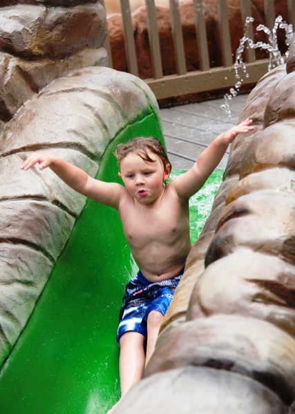 Toddler on one of the Water Slides at Salamander Springs Wilderness at the Smokies