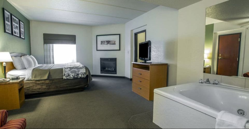 View of the 1 bedroom king suite with 2 person Jacuzzi and fireplace Sleep Inn Suites Gatlinburg 960