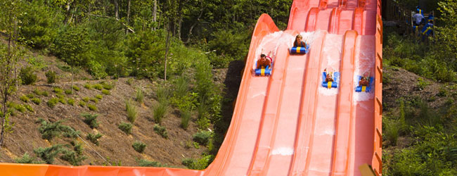 4 racing water slide lanes at the Slick Rock Racer in Dollywood Splash Country wide