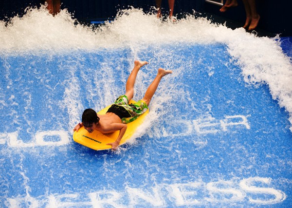 Kid riding the Surf Rider at the Waterdome Indoor Water Park