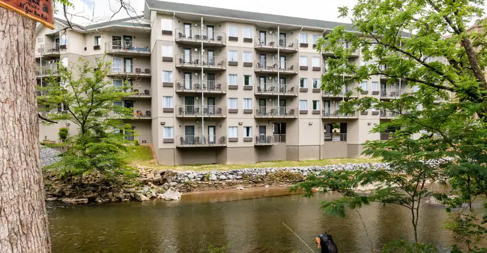 View of the rooms and suites from across the Pigeon River at the Twin Mountain Inn and Suites in Pigeon Forge 960