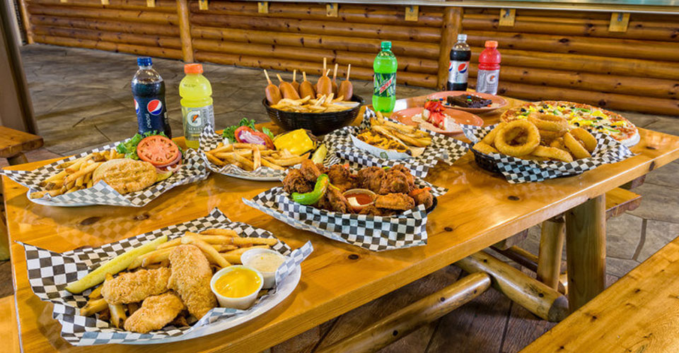 View of a table set with various dishes at the Roaring Fork Snack Bar at Westgate Smoky Mountain Resort