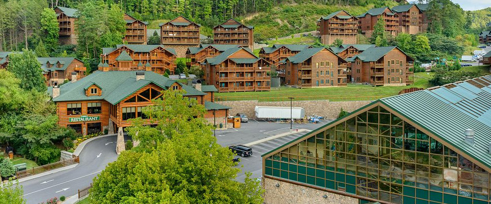 View of the Entrance to the Westgate Smoky Mountain Resort with Check-in on the Left and the Indoor Water Park Roofline on the right 960