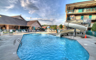 View of the Outdoor Pool and Cruvy Water Slide at the Willow Brook Lodge in Pigeon Forge Tn